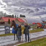 anne and phil with Olivia at their horse boarding facility in lynden