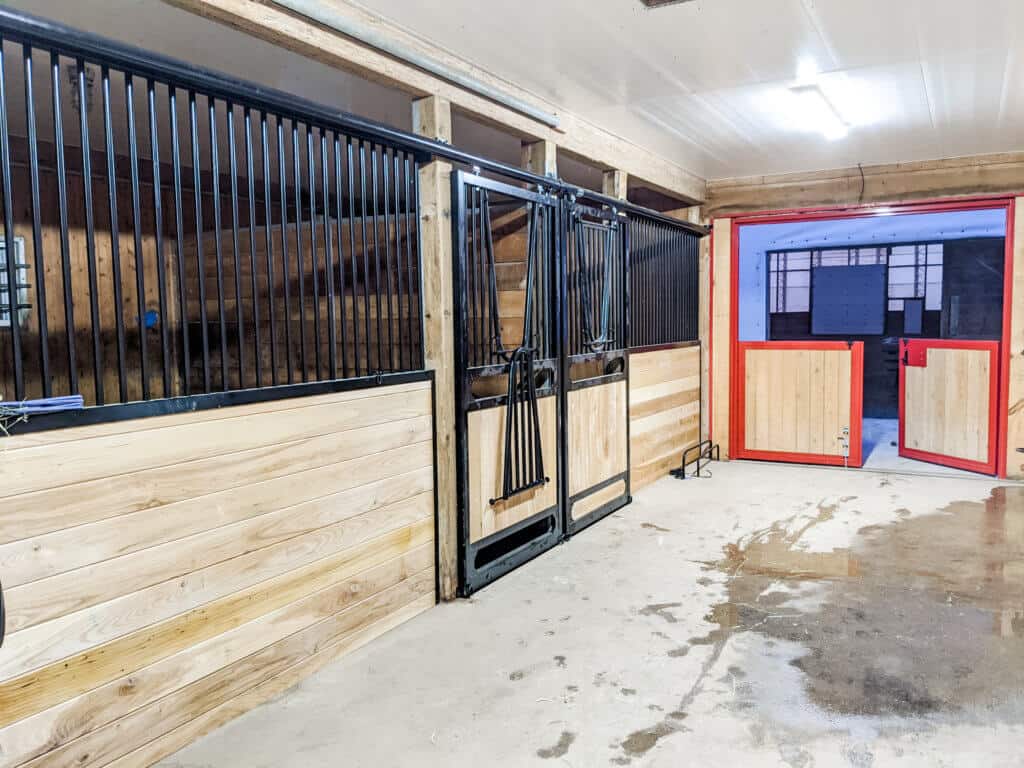 A Horse Stall With A Door And A Stall Door